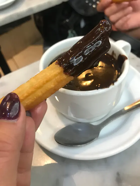 Spanish churro with dark chocolate dipping sauce.